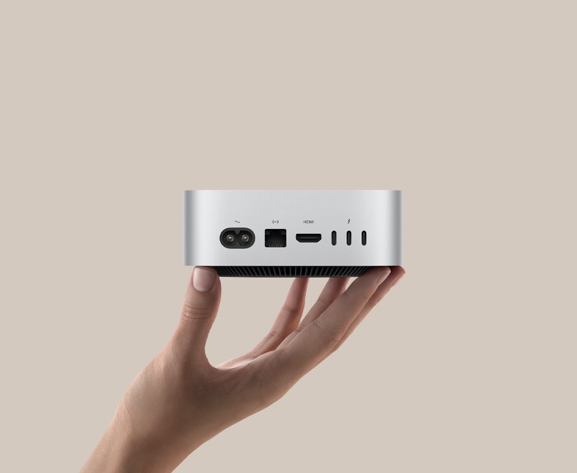 Rear ports on the M4 Mac mini showing the middle DFU Thunderbolt port