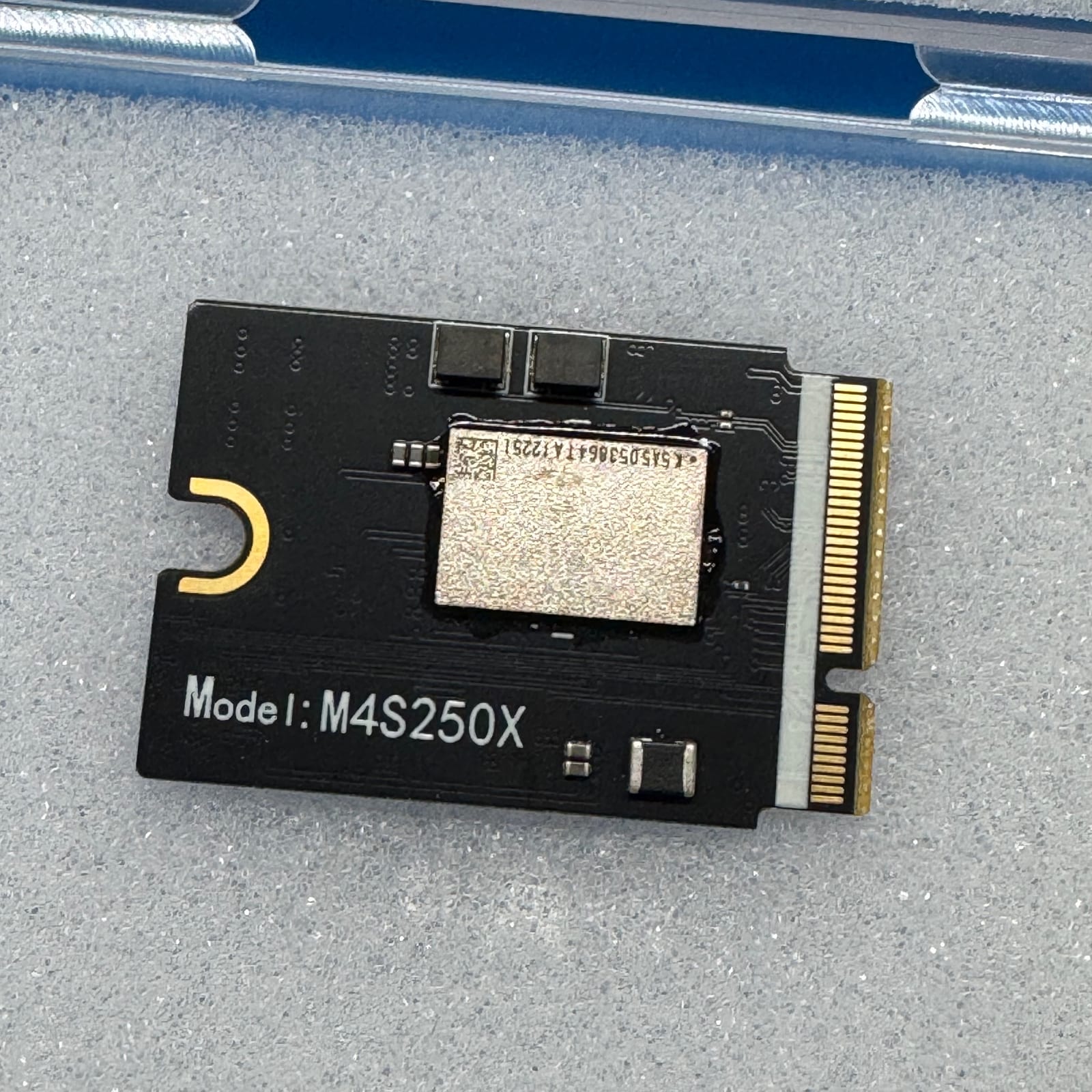Close-up of the M4S250X 1TB Mac mini SSD module from the eBay listing